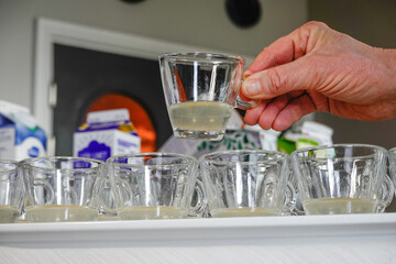 Halmstad, Sweden, Glasses with ginger shots at a buffet.