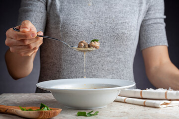 Turkish meatball soup (Terbiyeli kofte corbasi ) is a popular dish in Turkey where meatballs made with ground beef and rice are cooked in broth with egg mix and herbs and served hot with spices.