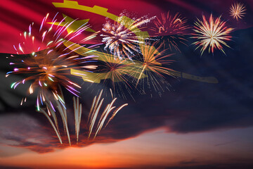 Night sky with fireworks and flag of Angola