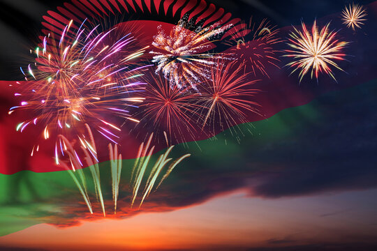 Night sky with fireworks and flag of Malawi