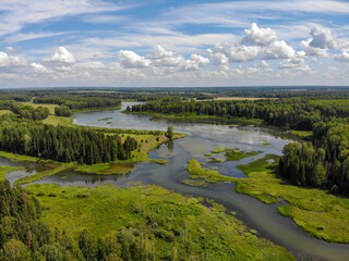 Fototapeta na wymiar Aerial view of the pond into which the Ryabovka and Kordyaga rivers flow (Ryabovo, Kirov region, Russia)