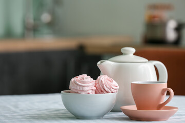 Composition with teapot on table in kitchen