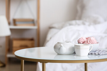 Composition with teapot on table