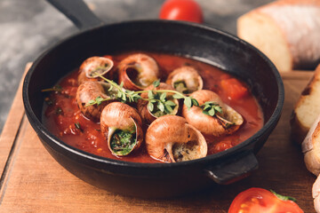 Frying pan with tasty snails, closeup
