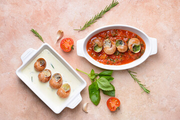 Baking dishes with tasty snails on color background