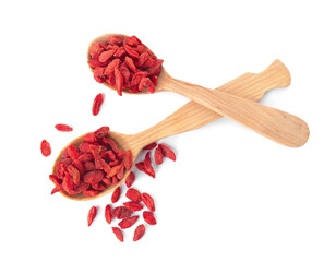Spoons with dried goji berries on white background