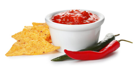 Bowl of tasty salsa sauce with peppers and nachos on white background