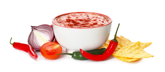 Bowl of tasty salsa sauce with ingredients and nachos on white background