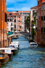 Small canal and view to Ponte dei Greci, Venice, Italy