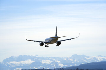 Fototapeta na wymiar Airplane landing at Zurich airport. Photo taken March 28th, 2021, Kloten, Zurich.