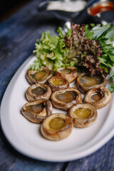mushrooms mushrooms cooked on a grated blue table