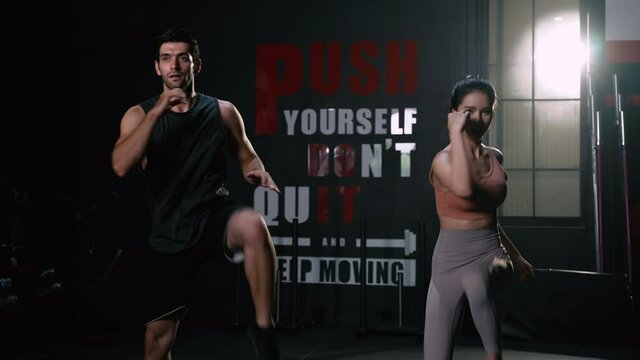 Sporty Couple Cardio Exercise Burning Calorie HIIT and Squat in Fitness Gym Fit Body Healthy Lifestyle Athlete Muscle Building Strong Concept.