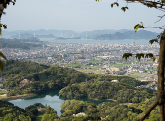 Scenic view of Imabari city and Shimanami Kaido from an overlook near Senyuji, temple number 58 of...