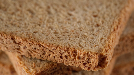 slices toast bread with bran close up