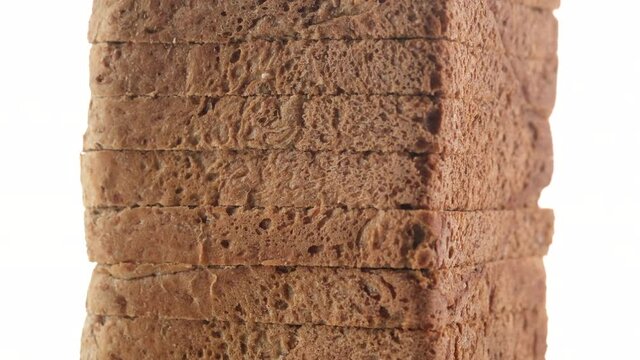 slices toast bread isolated on white background. the frame moves from bottom to top. 4K UHD video