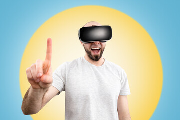 VR glasses. A wondered man in virtual reality glasses, with his mouth slightly open, points a finger into space. Blue background with a yellow circle. The concept of virtual reality