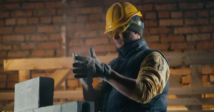 Male builder coughing during work