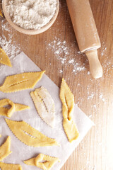cooking traditional french bugne- carnival cake, angels wings