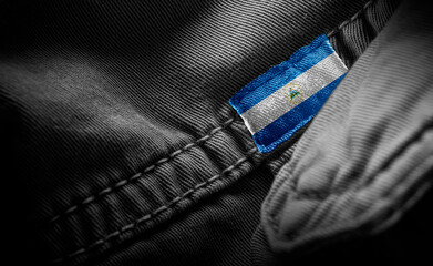 Tag on dark clothing in the form of the flag of the Nicaragua