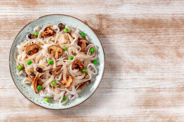Konjac pasta with vegetables, shot from above with copy space