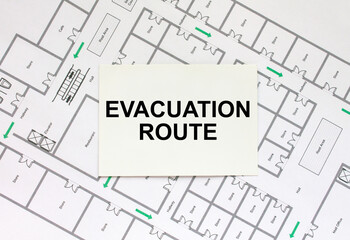 Business card with text Evacuation Plan on a construction drawing