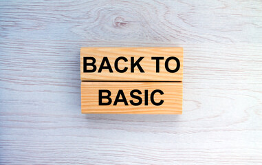 Obraz premium Wooden blocks with text Back To Basic on the wooden background