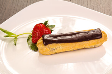 Sweet tasty eclair with chocolate