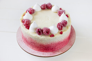 Raspberry cake on white background