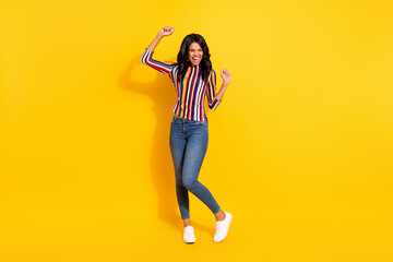 Full body photo of pretty excited dark skin lady closed eyes open mouth partying isolated on yellow...