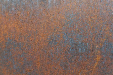 Closeup of Surface peeling old car paint cracked with rusty background