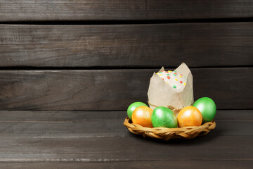 Easter, eggs, holiday. Easter cake and colorful eggs on a dark background.