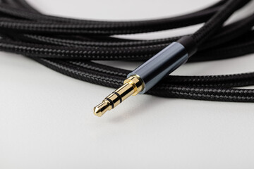 Flexible audio cable with plug for connecting electronics.