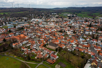 Fototapeta na wymiar Aerial view of the city Schlüchtern in Germany, Hesse on a sunny day in early spring