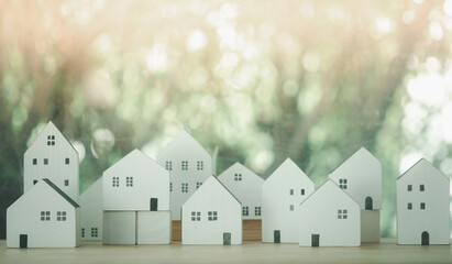 Different size wood house model on wood table, Planning buy real or property.