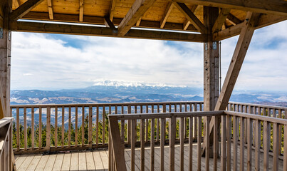 Panorama of the Tatra Mountains from the scenic viewpoint on the tower situated on the highest peak of Beskid Sadecki - Radziejowa Summit. The peak belongs to the so-called Crown of Polish Mountains.