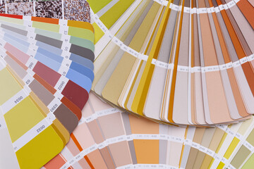 Close-up on color palette guide for printing and painting. Concept - choice of colors for design.