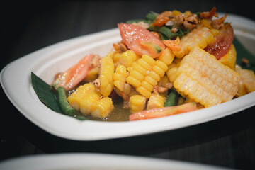 Corn cooked like Thai 's papaya salad in paper dish.