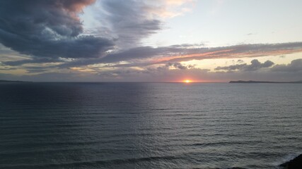 colorful sunset sky and horizon and clouds, in karavostasi beach of perdika in epirus, greece