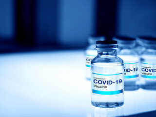 Covid-19 Coronavirus vaccine bottle with label.