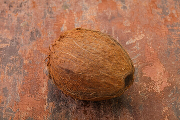 Tropical brown coconut over background