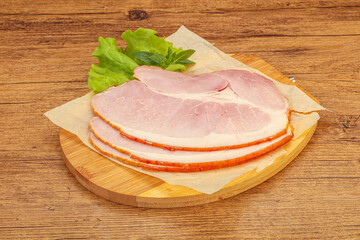 Sliced pork belly over board