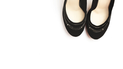 Black female high heel shoes isolated on white background. Flat lay, top view