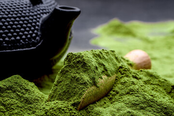 Powdered green tea and set for matcha on black background - obrazy, fototapety, plakaty