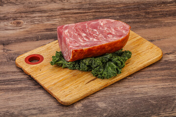 Beef ham piece over board