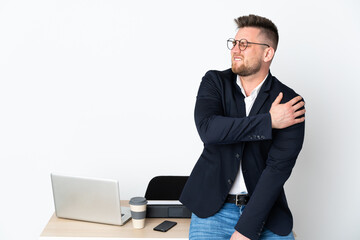 Russian man in a office isolated on white background suffering from pain in shoulder for having made an effort