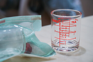 Measuring cup and liquid storage
