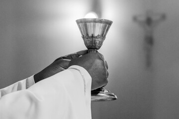hands of the pope celebrated the Eucharist with body and blood of christ