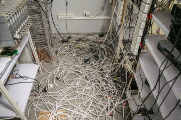 Lots of coaxial cables lie on the floor of an abandoned TV station. Telecommunication equipment...