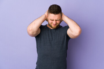 Russian handsome man over isolated background frustrated and covering ears