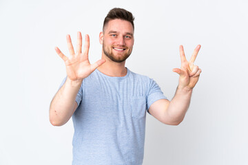 Russian handsome man over isolated background counting eight with fingers